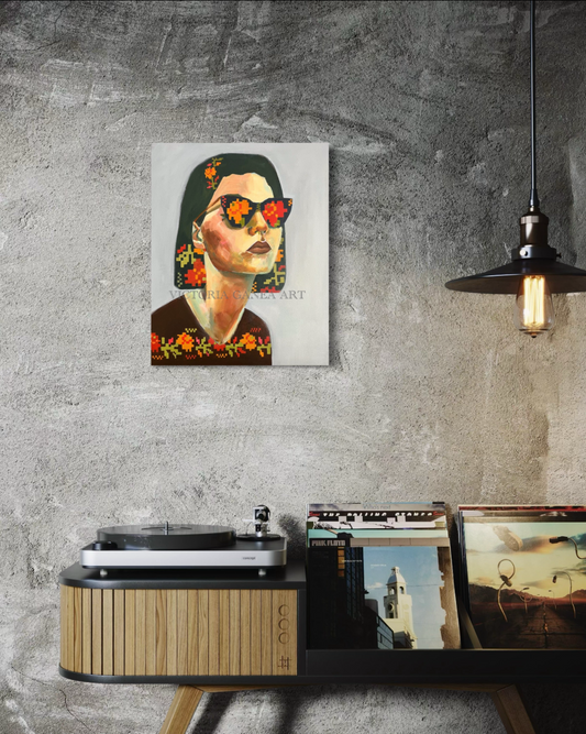 Original painting of a stylized portrait with sunglasses on a wall