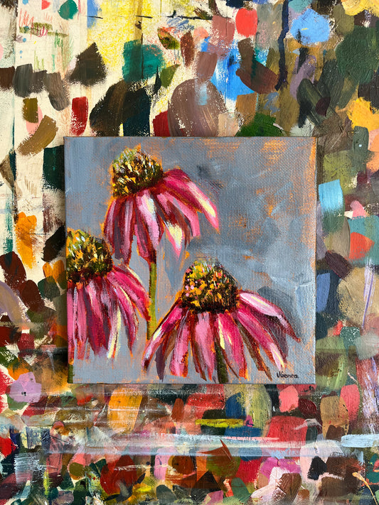 Acrylic painting of pink flowers with a colourful abstract background